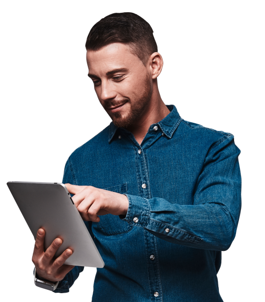 surfing-net-good-looking-young-man-smart-casual-wear-using-digital-tablet-smiling-while-standing-against-grey-background 1